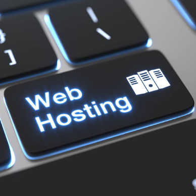 A computer keyboard with white text that reads web hosting on black keys