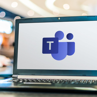 Laptop computer displaying logo of Microsoft Teams.