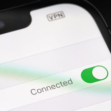 Apple iPhone with VPN settings on screen.