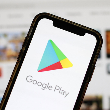 Google Play Store logo displayed on a smartphone screen with a blurred digital marketplace interface in the background.