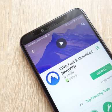 VPN: Fast and Unlimited NordVPN app on Google Play Store website displayed on phone screen.