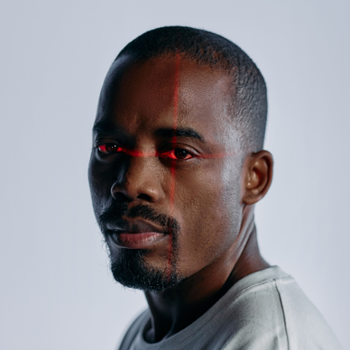 Close up of a man with a laser scan over his eyes.