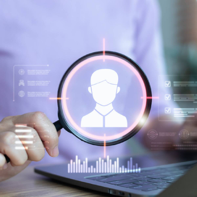 concept of someone looking up another person using a data broker or people search site like USPhoneBook, with a person holding a magnifying glass over digital profile image above a laptop and 