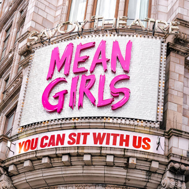 Exterior of Savoy Theatre displaying "Mean Girls, You Can Sit With Us"