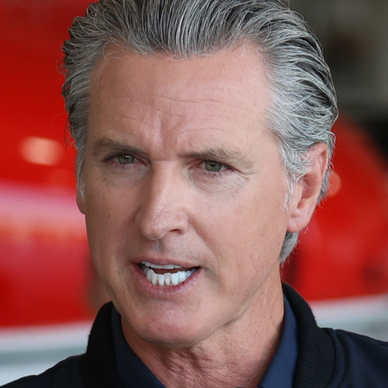 Governor Gavin Newsom speaking at a conference.