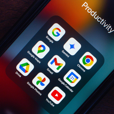 Various Google productivity apps like Gemini, Chrome, Maps, Gmail, Drive, Photos, and YouTube are displayed on a smartphone screen.