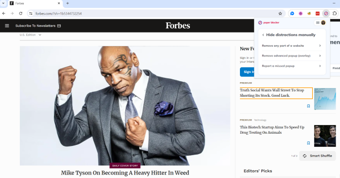 The Forbes homepage with the Poper Blocker extension open.