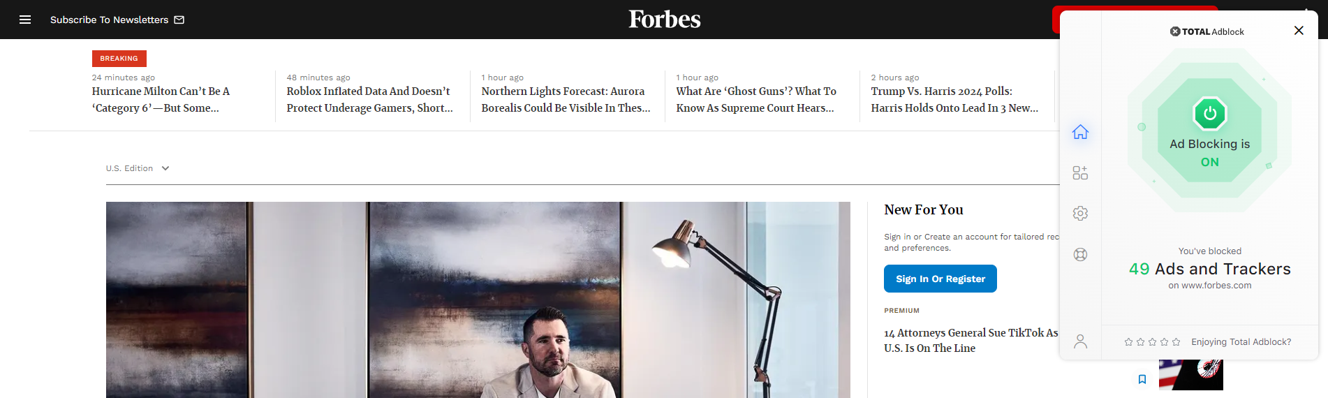 Forbes homepage with Total Adblock extension open