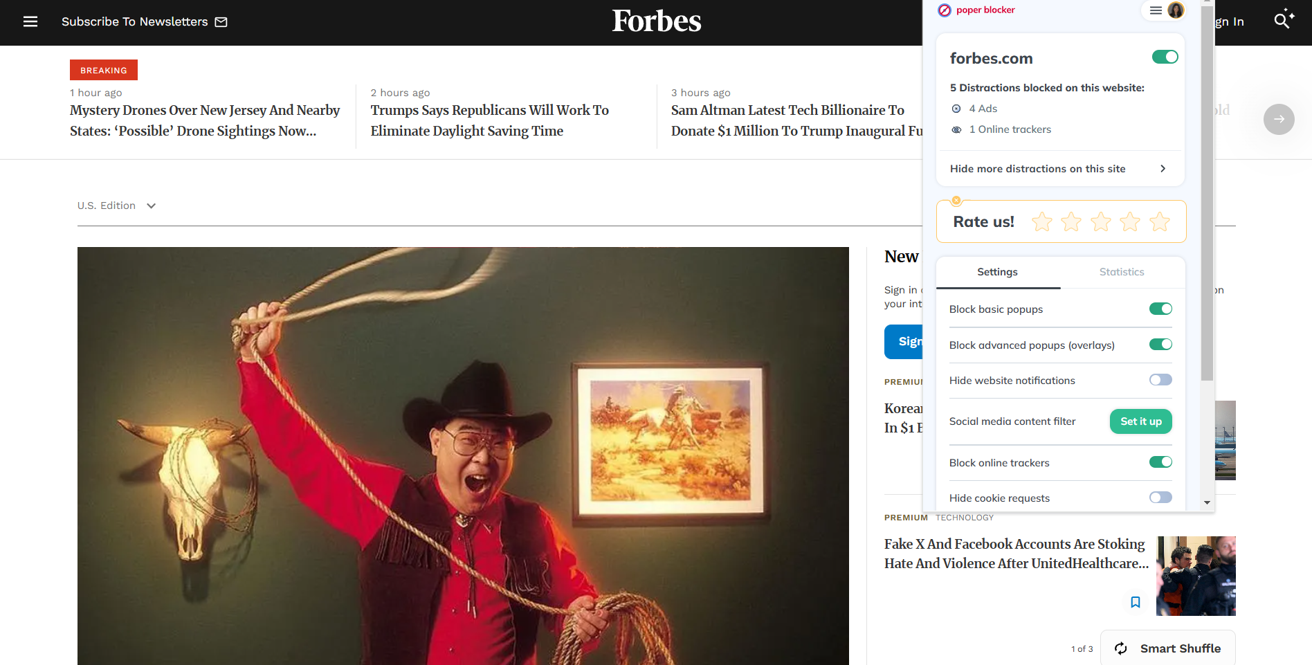 The Forbes homepage with Poper Blocker extension open (5 distractions blocked)