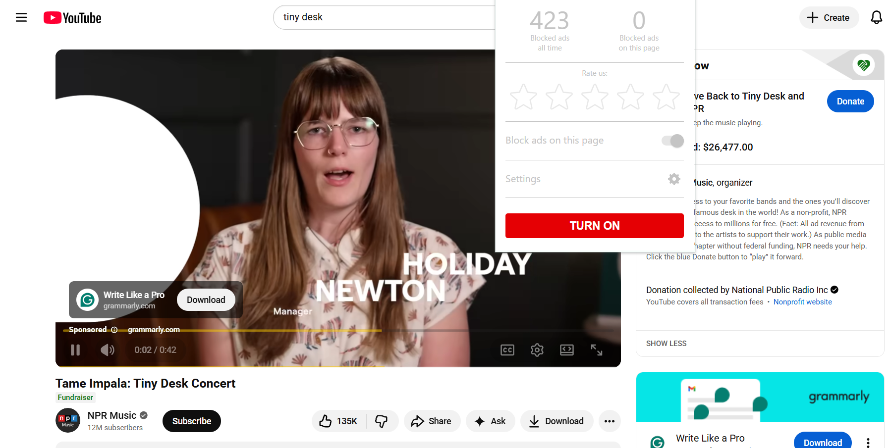 A YouTube video playing a pre-roll ad with AdLock turned off in the foreground.