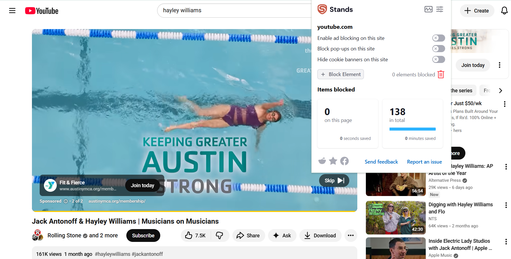 A YouTube video playing a pre-roll ad with Stands Free AdBlocker paused in the foreground.