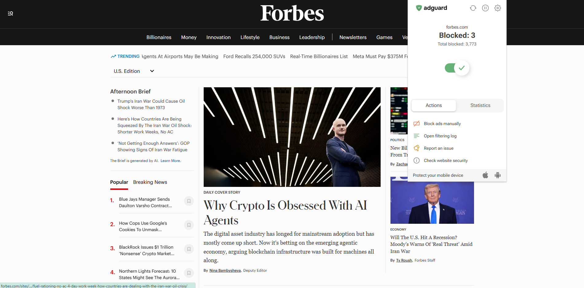 Forbes homepage with AdGuard extension open in the foreground