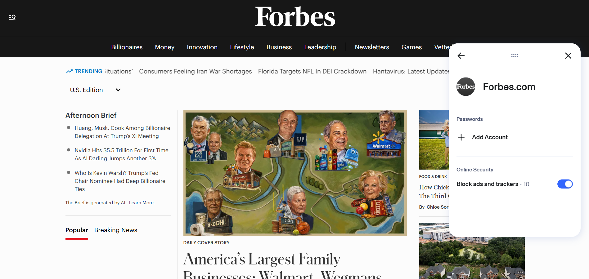 Forbes homepage with Aura Ad blocker extension in the foreground