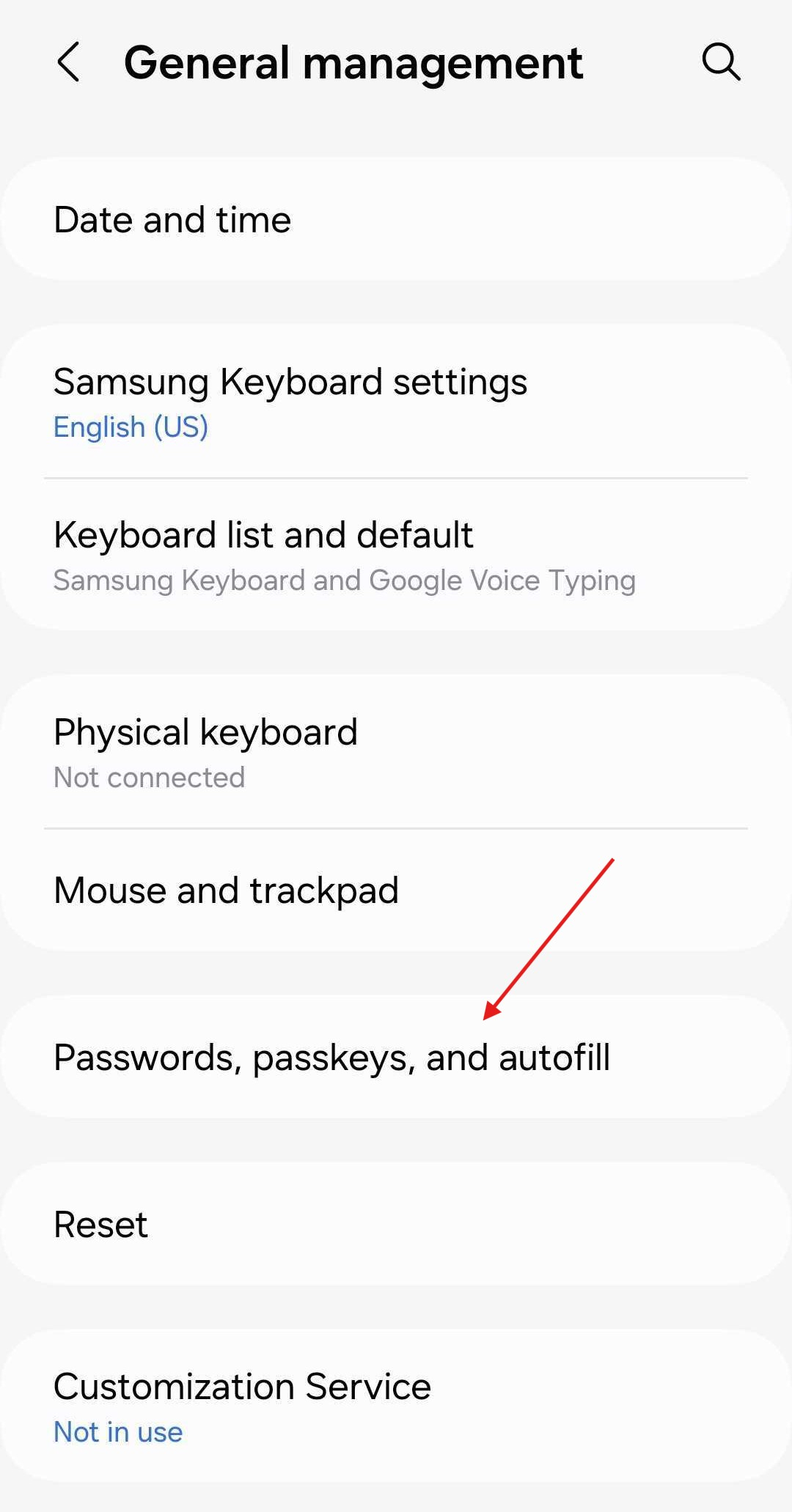 Android general management settings with an arrow pointing to Passwords, passkeys, and autofill
