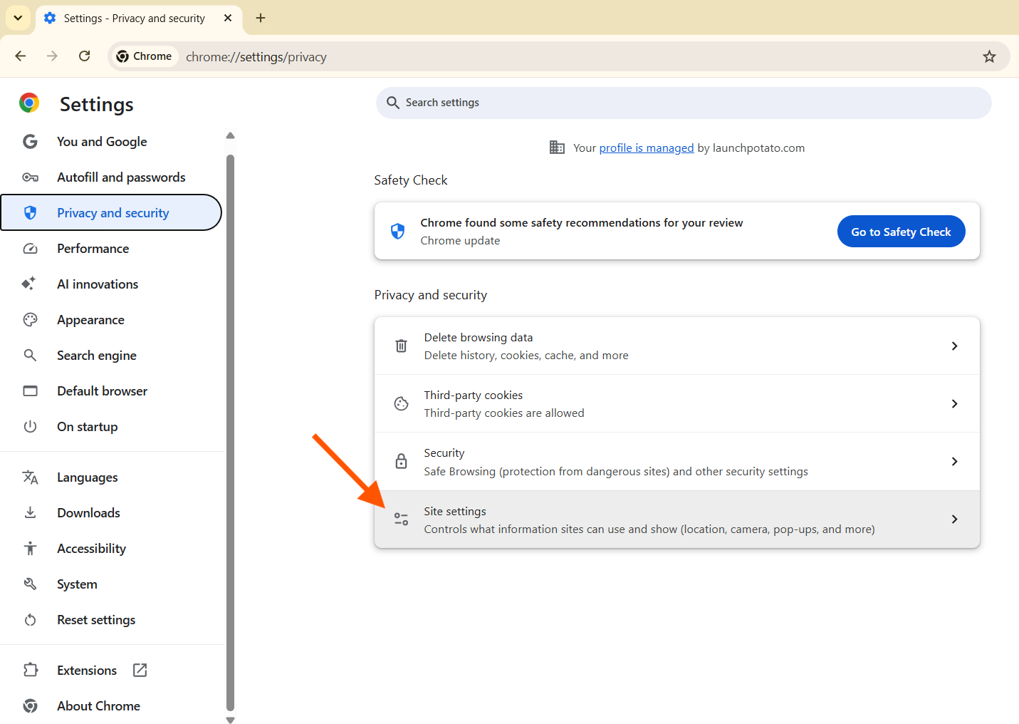 Google Chrome privacy and security settings with arrow pointing at site settings